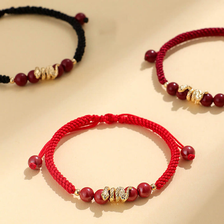 Pulsera trenzada de protección hecha a mano con Buddha Stones y cinabrio con hilo de serpiente