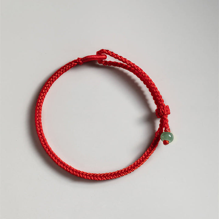 Pulsera de jade con hilo rojo y Buddha Stones