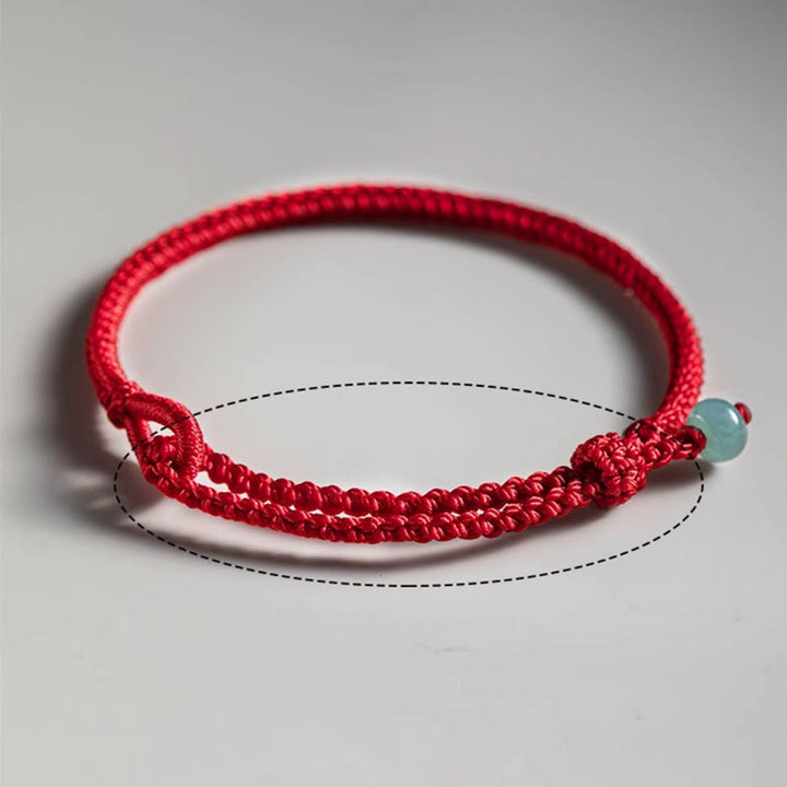 Pulsera de jade con hilo rojo y Buddha Stones