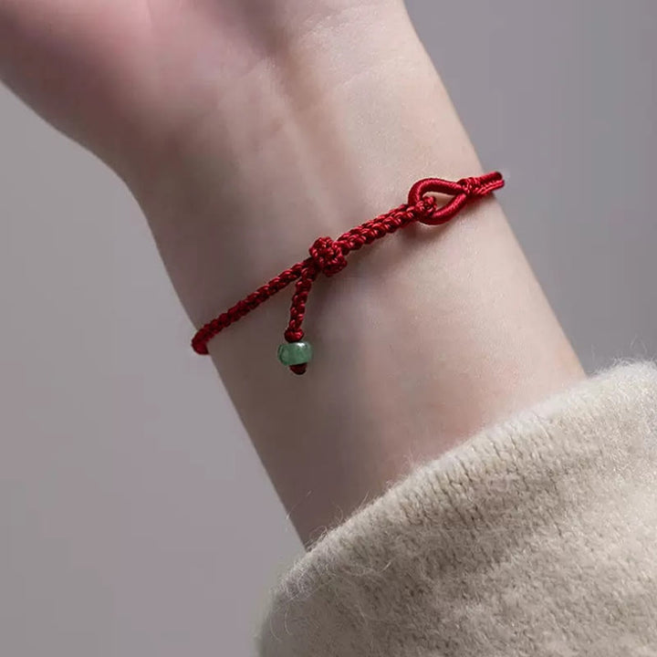Pulsera de jade con hilo rojo y Buddha Stones