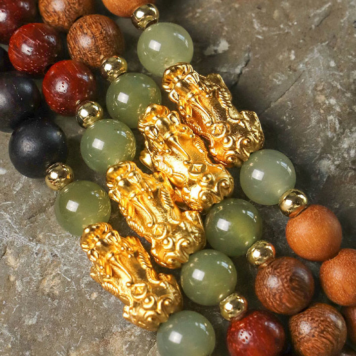 Pulsera de la riqueza PiXiu con hojas pequeñas de sándalo, ébano, sándalo rojo, jade hetiano, cinabrio y Buddha Stones en plata de ley 999