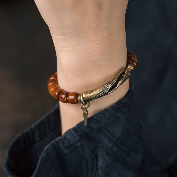 Pulsera de fuerza con colgante de cono de cobre y cuentas de hueso de Buddha Stones