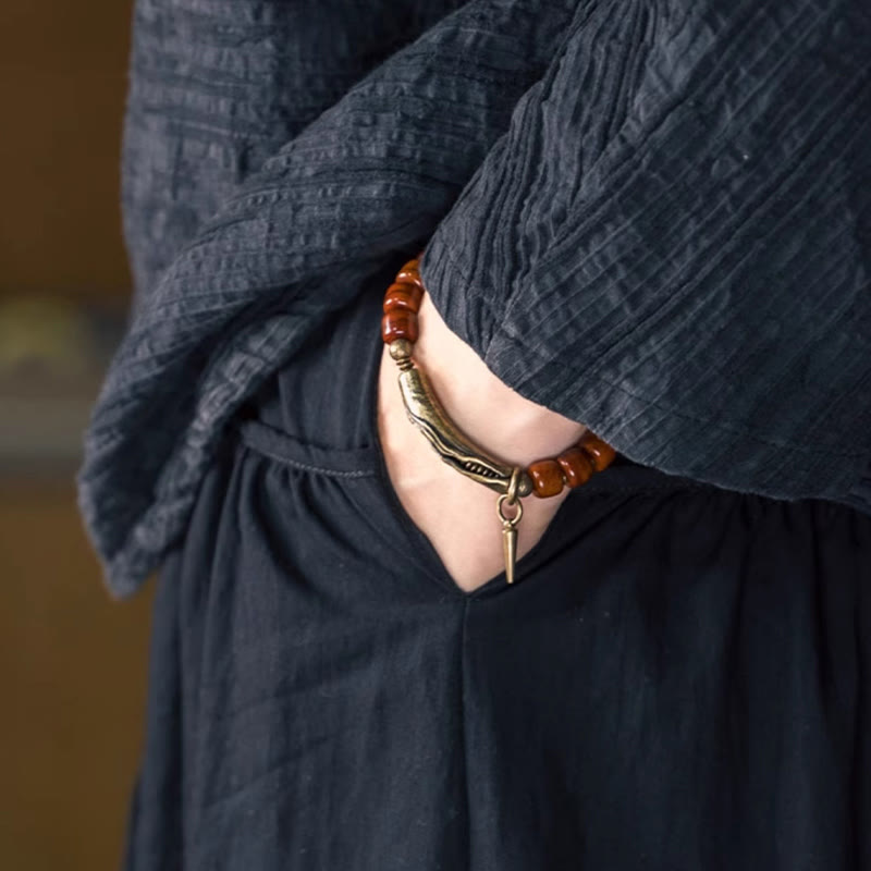 Pulsera de fuerza con colgante de cono de cobre y cuentas de hueso de Buddha Stones