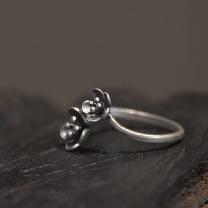 Anillo de flores de plata de ley 925 con Buddha Stones