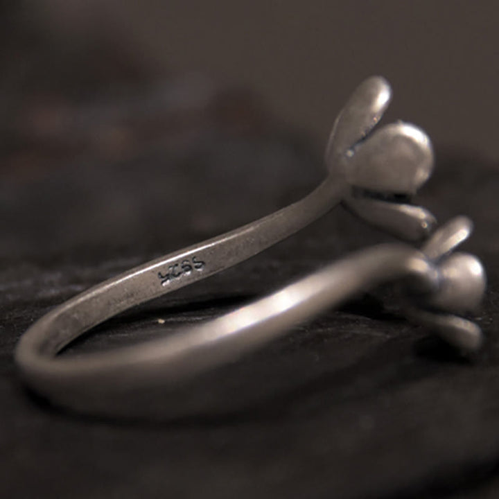 Anillo de flores de plata de ley 925 con Buddha Stones