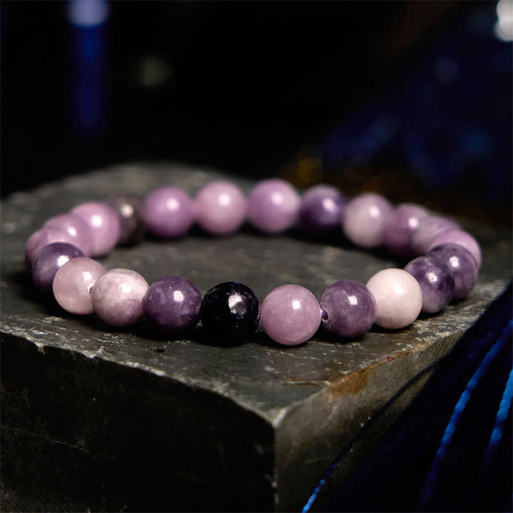 Pulsera positiva con piedra de mica morada y Buddha Stones