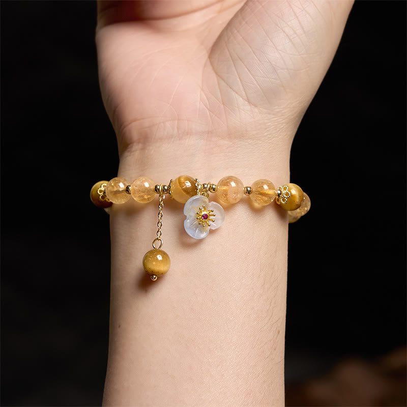 Pulsera de generosidad con dije de flor de ojo de tigre y citrino de Buddha Stones