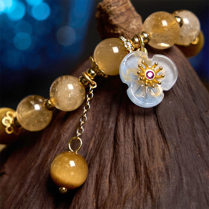 Pulsera de generosidad con dije de flor de ojo de tigre y citrino de Buddha Stones
