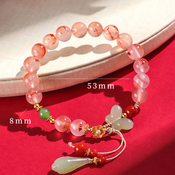 Buddha Stones, ágata roja del sur, orquídea mariposa y jade hetiano