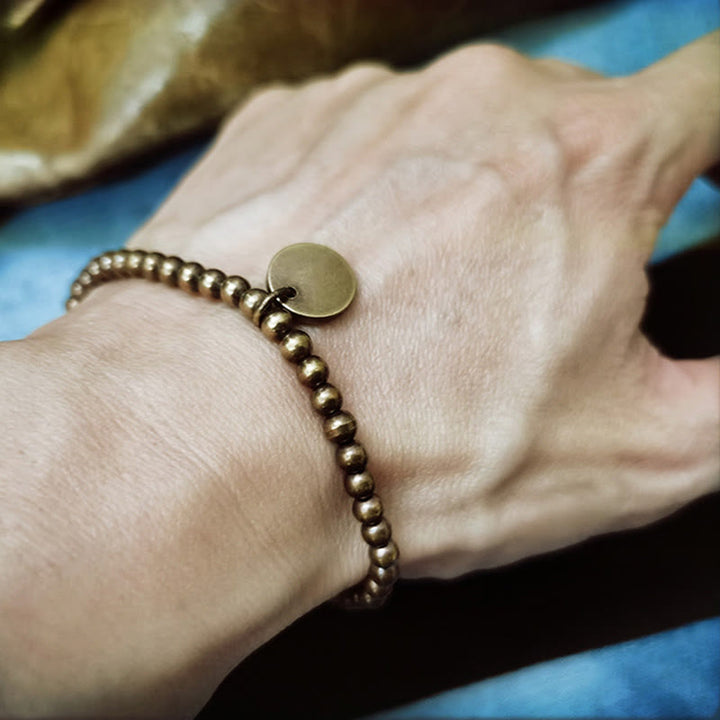 Pulsera de equilibrio de cobre Amekaji con Buddha Stones