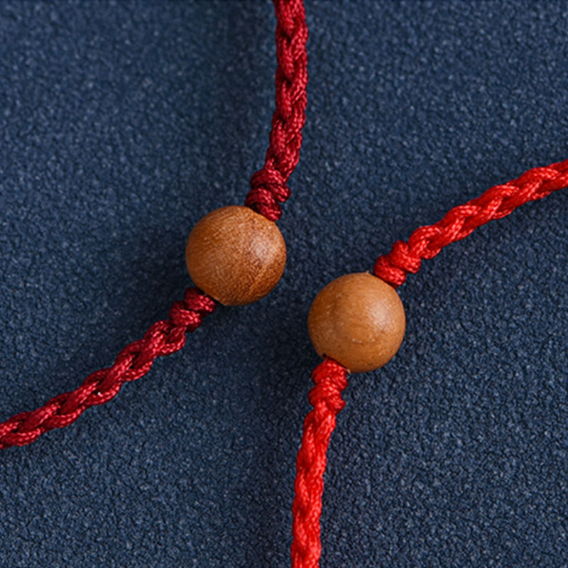 Pulsera trenzada con cuentas de madera de melocotón natural y Buddha Stones que alejan a los malos espíritus