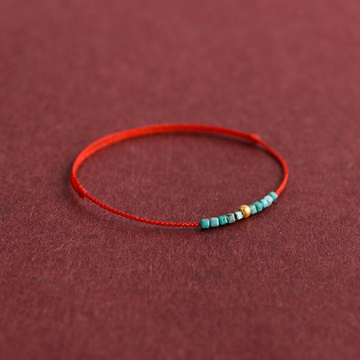 Pulsera trenzada con protección turquesa y cuentas de oro 999 de Buddha Stones