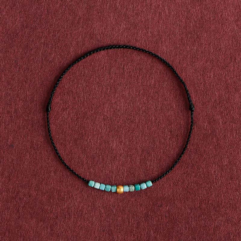Pulsera trenzada con protección turquesa y cuentas de oro 999 de Buddha Stones