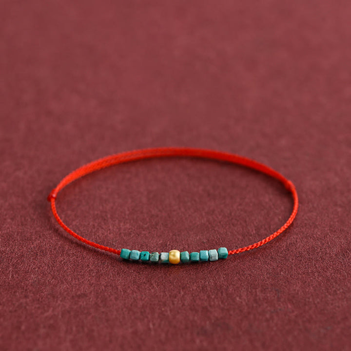 Pulsera trenzada con protección turquesa y cuentas de oro 999 de Buddha Stones