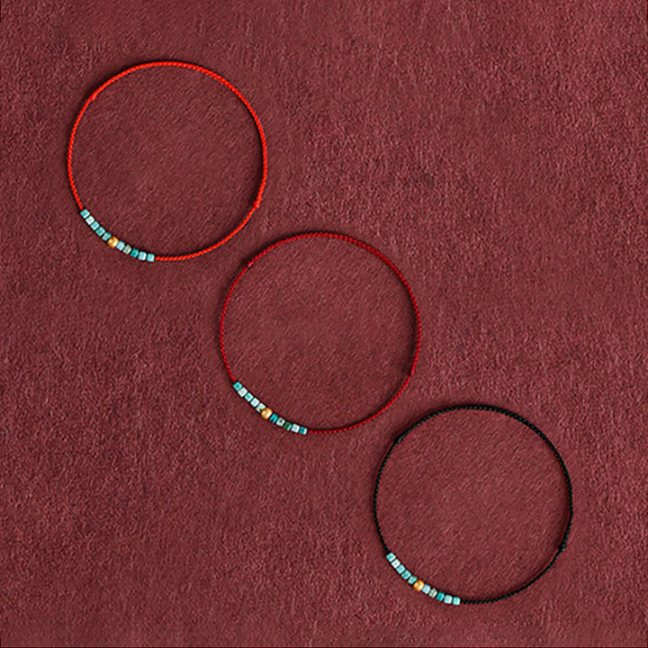 Pulsera trenzada con protección turquesa y cuentas de oro 999 de Buddha Stones