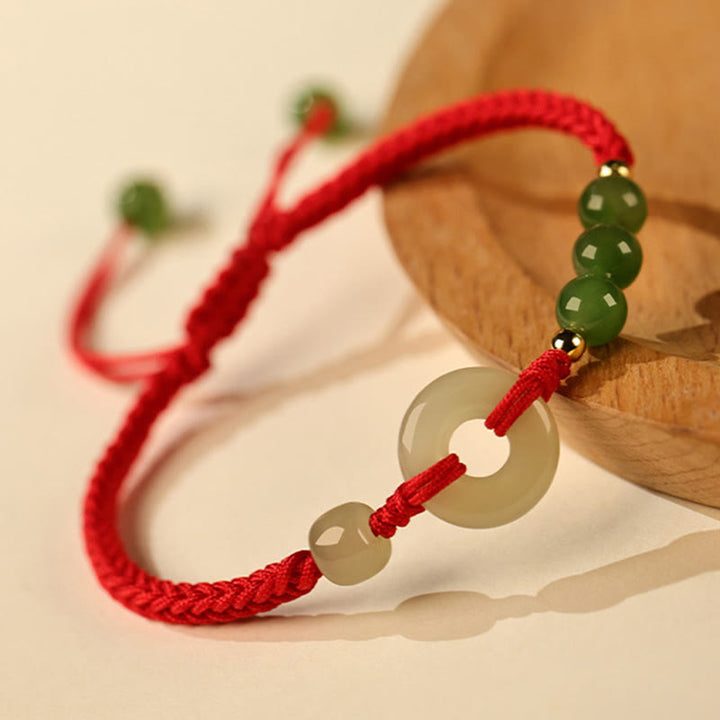 Pulsera de protección de la suerte con hilo rojo y hebilla de paz de jade hetiano natural con Buddha Stones