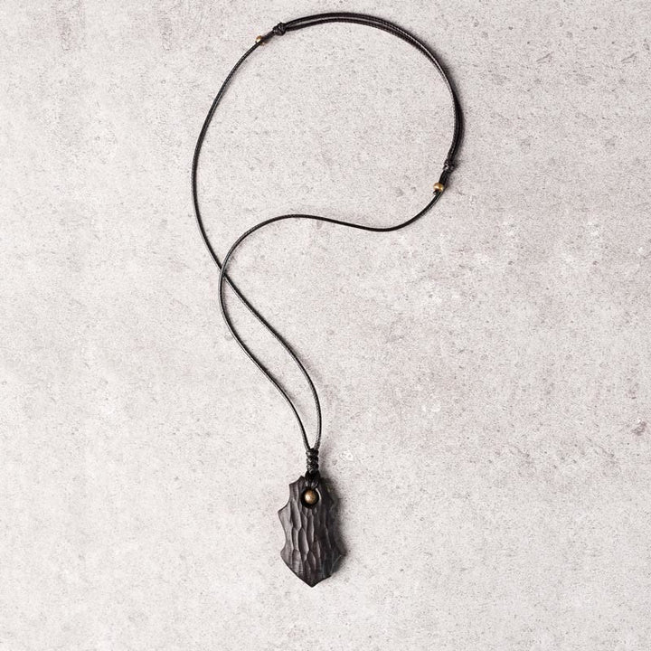 Collar con colgante de paz y calma con cuentas de cobre de forma irregular de madera de ébano y Buddha Stones