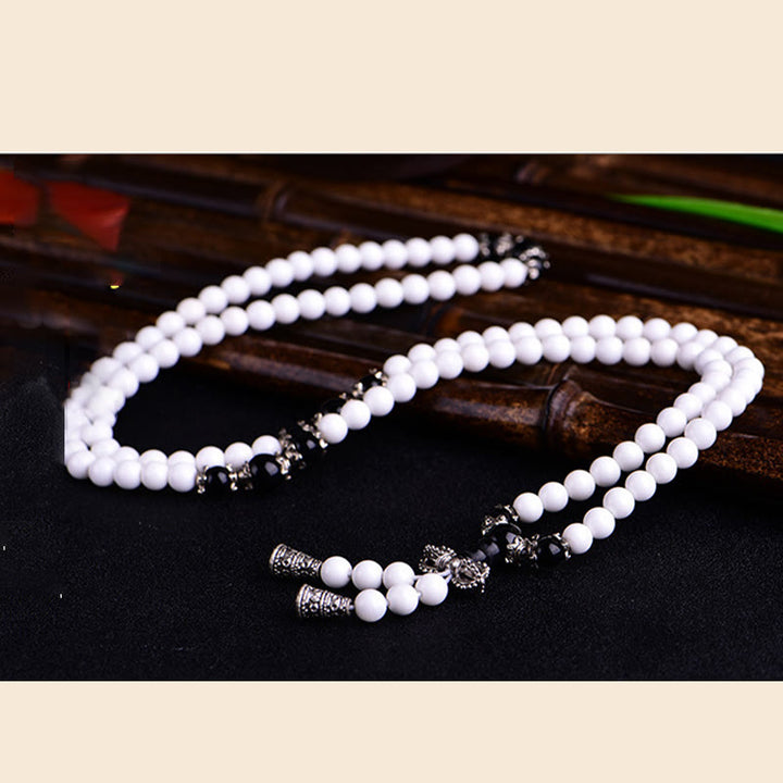 Pulsera de la paciencia con seis palabras verdaderas 'Om Mani Padme Hum' de porcelana blanca con 108 cuentas de Buddha Stones