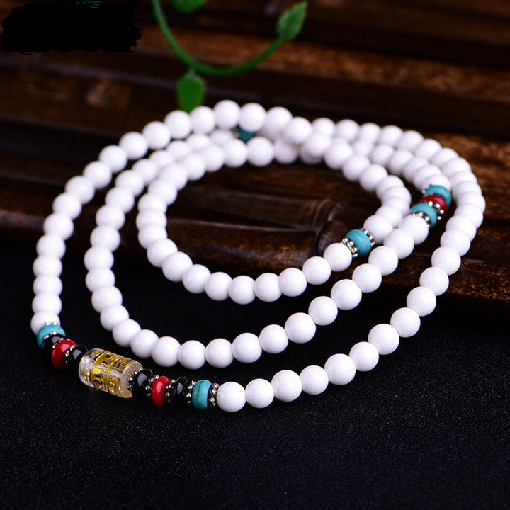 Pulsera de la paciencia con seis palabras verdaderas 'Om Mani Padme Hum' de porcelana blanca con 108 cuentas de Buddha Stones