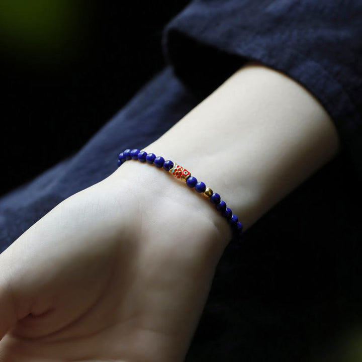 Pulsera positiva con pez koi y lazurita de Buddha Stones