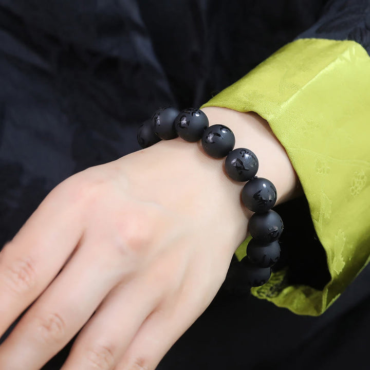 Pulsera de protección tallada con Om Mani Padme Hum y ónix negro natural de Buddha Stones