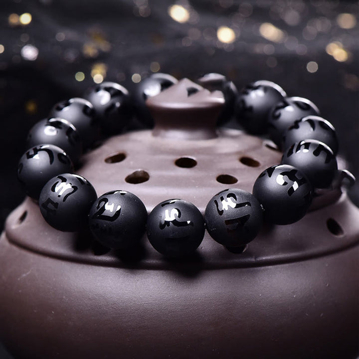 Pulsera de protección tallada con Om Mani Padme Hum y ónix negro natural de Buddha Stones