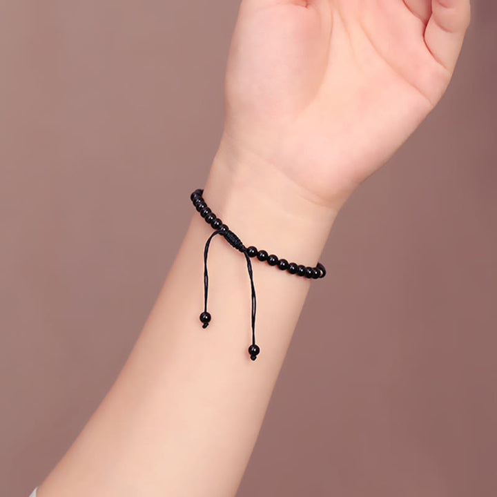Pulsera de cuerda con cuentas pequeñas de obsidiana negra y Buddha Stones