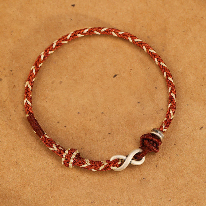 Pulsera de cuerda con símbolo de la suerte y nudo infinito hecha a mano en plata de ley 999 con Buddha Stones