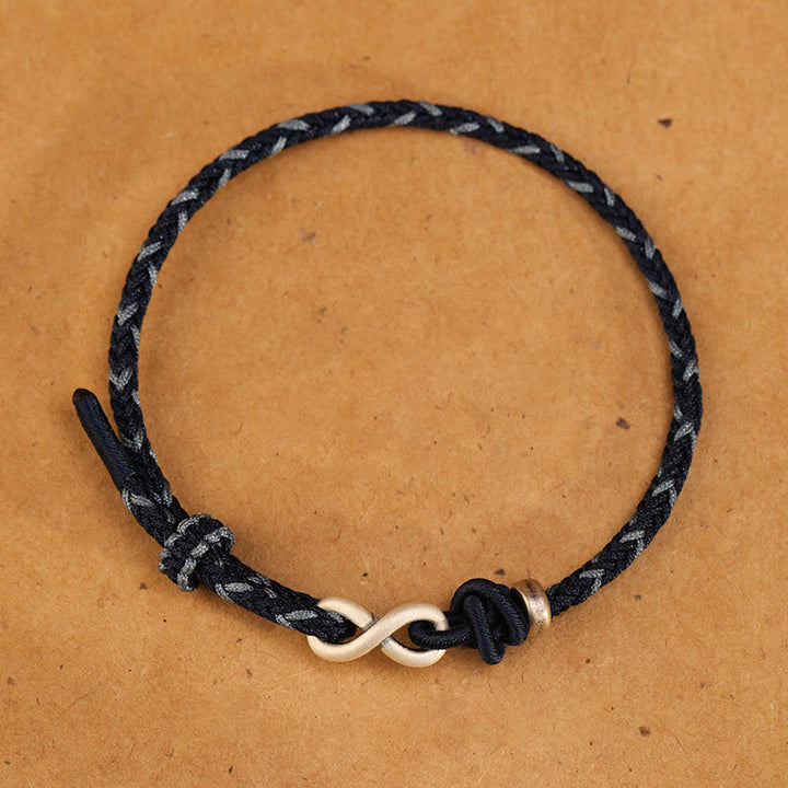 Pulsera de cuerda con símbolo de la suerte y nudo infinito hecha a mano en plata de ley 999 con Buddha Stones