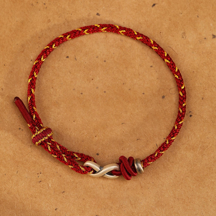Pulsera de cuerda con símbolo de la suerte y nudo infinito hecha a mano en plata de ley 999 con Buddha Stones