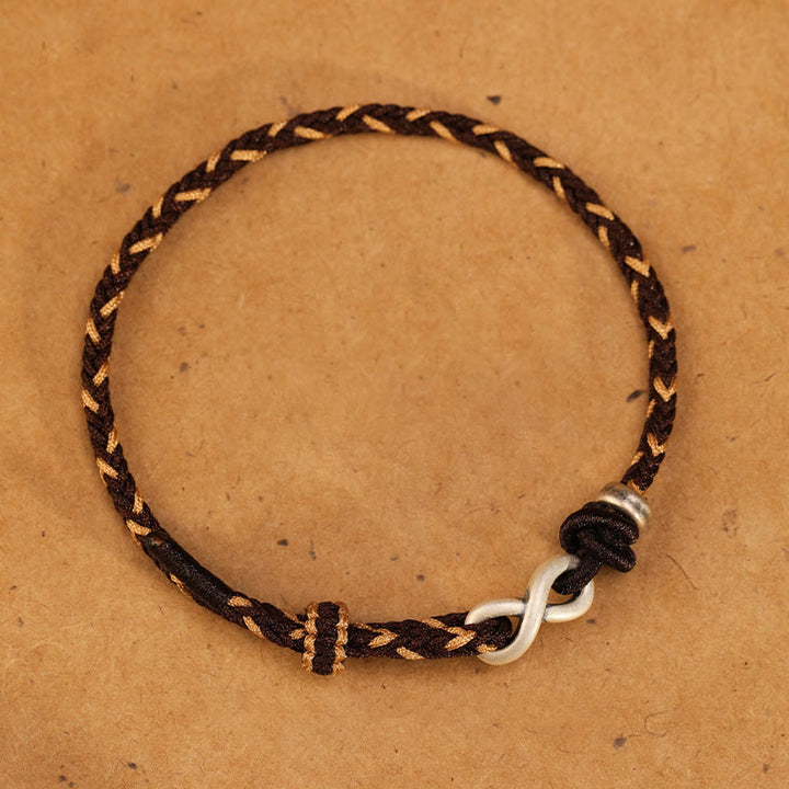 Pulsera de cuerda con símbolo de la suerte y nudo infinito hecha a mano en plata de ley 999 con Buddha Stones