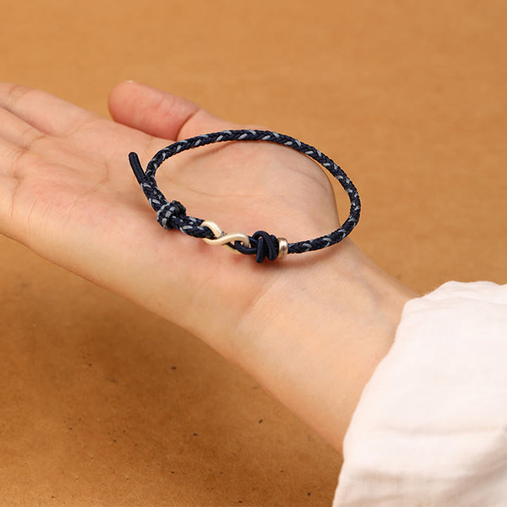 Pulsera de cuerda con símbolo de la suerte y nudo infinito hecha a mano en plata de ley 999 con Buddha Stones