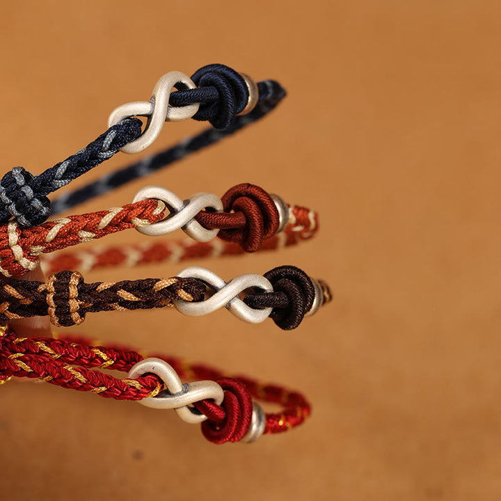 Pulsera de cuerda con símbolo de la suerte y nudo infinito hecha a mano en plata de ley 999 con Buddha Stones
