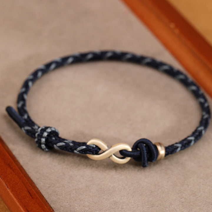 Pulsera de cuerda con símbolo de la suerte y nudo infinito hecha a mano en plata de ley 999 con Buddha Stones