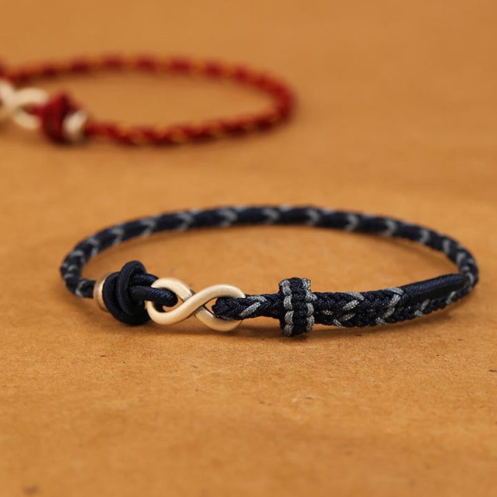 Pulsera de cuerda con símbolo de la suerte y nudo infinito hecha a mano en plata de ley 999 con Buddha Stones