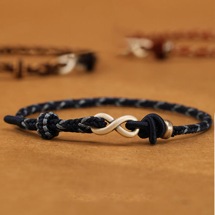 Pulsera de cuerda con símbolo de la suerte y nudo infinito hecha a mano en plata de ley 999 con Buddha Stones