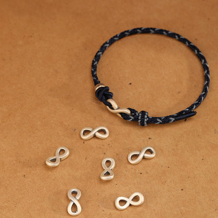 Pulsera de cuerda con símbolo de la suerte y nudo infinito hecha a mano en plata de ley 999 con Buddha Stones