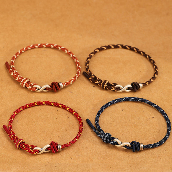 Pulsera de cuerda con símbolo de la suerte y nudo infinito hecha a mano en plata de ley 999 con Buddha Stones