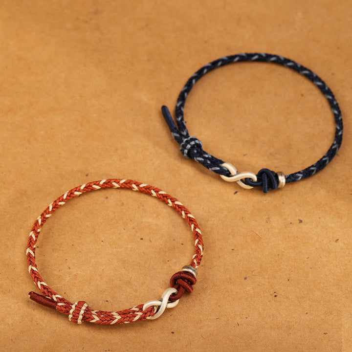 Pulsera de cuerda con símbolo de la suerte y nudo infinito hecha a mano en plata de ley 999 con Buddha Stones
