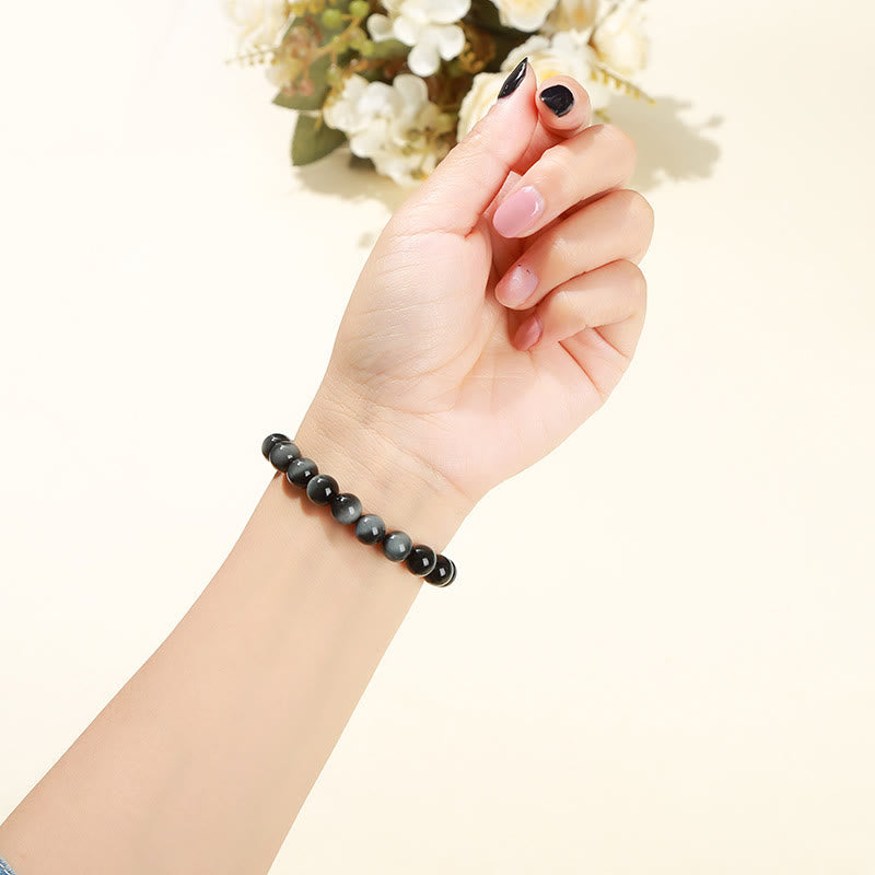 Pulsera positiva de piedra de ojo de águila natural de Buddha Stones