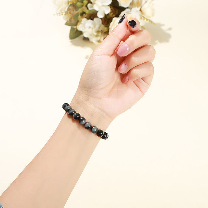 Pulsera positiva de piedra de ojo de águila natural de Buddha Stones