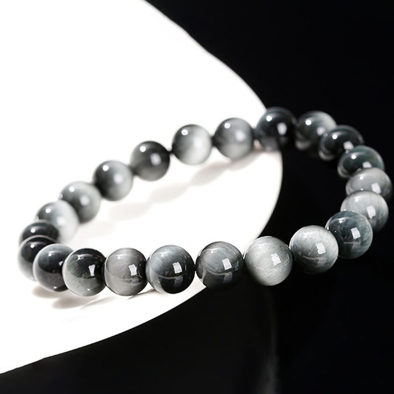 Pulsera positiva de piedra de ojo de águila natural de Buddha Stones