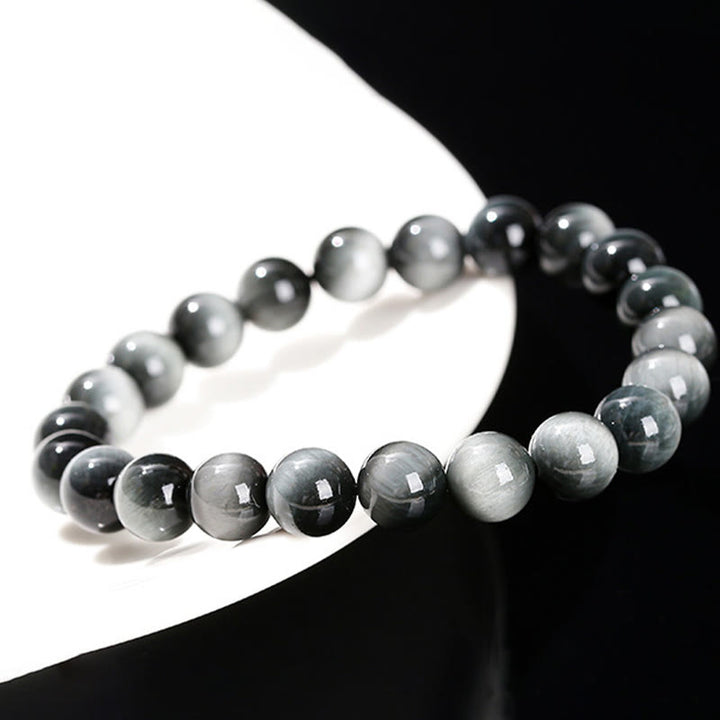Pulsera positiva de piedra de ojo de águila natural de Buddha Stones