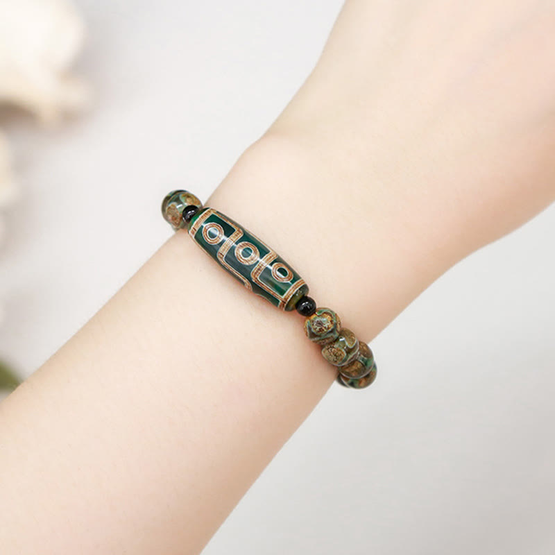 Pulsera de protección de energía con Buddha Stones de nueve ojos tibetanas de sándalo natural y ágata de ojo de gato blanca