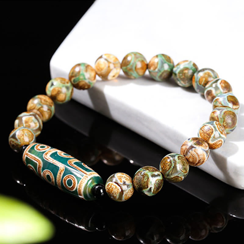 Pulsera de protección de energía con Buddha Stones de nueve ojos tibetanas de sándalo natural y ágata de ojo de gato blanca