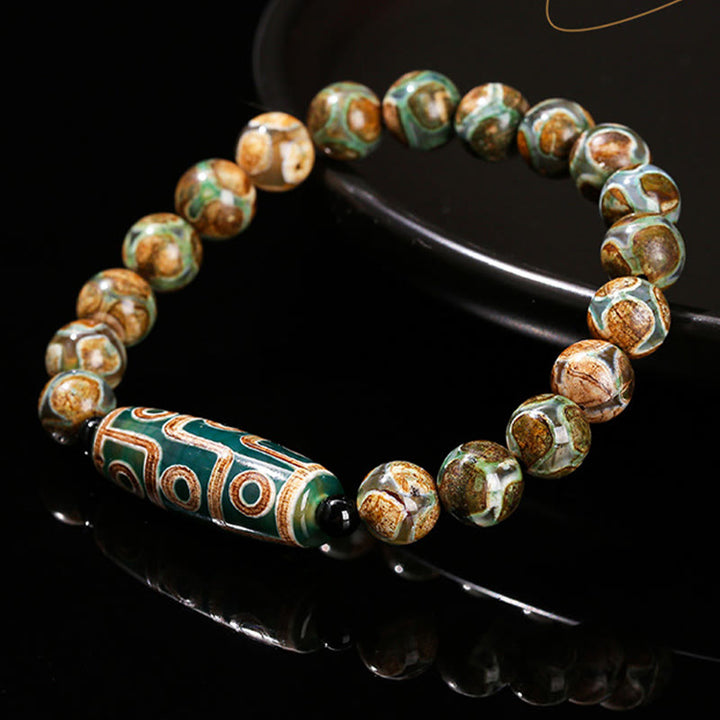 Pulsera de protección de energía con Buddha Stones de nueve ojos tibetanas de sándalo natural y ágata de ojo de gato blanca