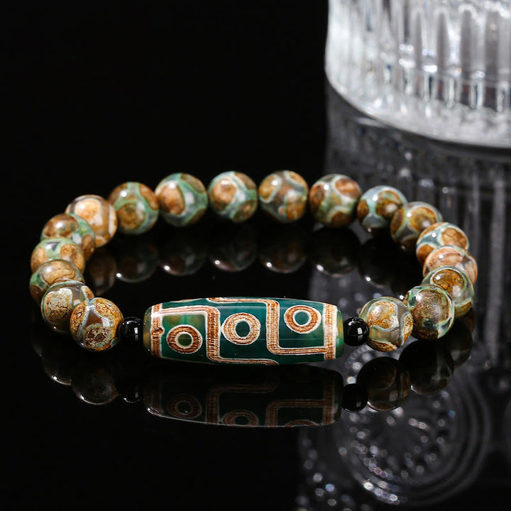 Pulsera de protección de energía con Buddha Stones de nueve ojos tibetanas de sándalo natural y ágata de ojo de gato blanca