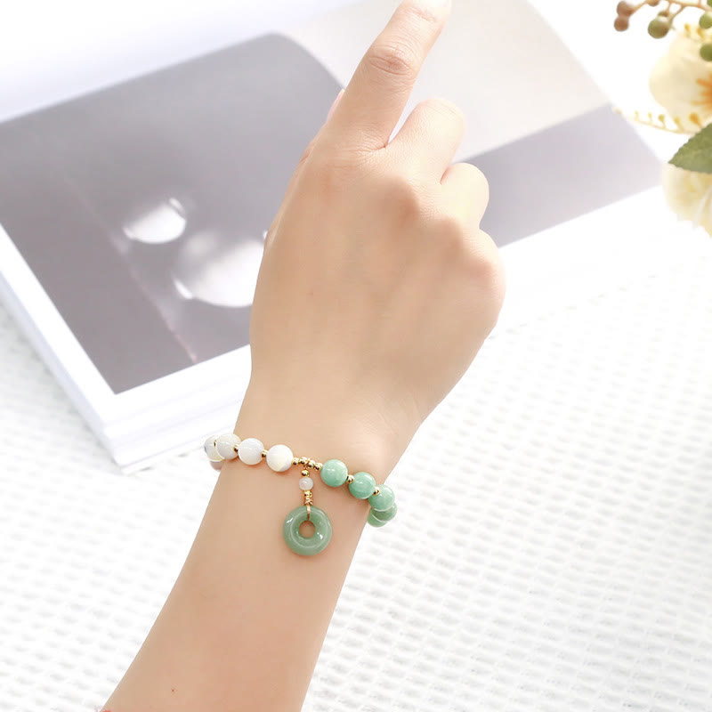 Pulsera con dije de paz y hebilla de caracol, herradura, trochus y Buddha Stones