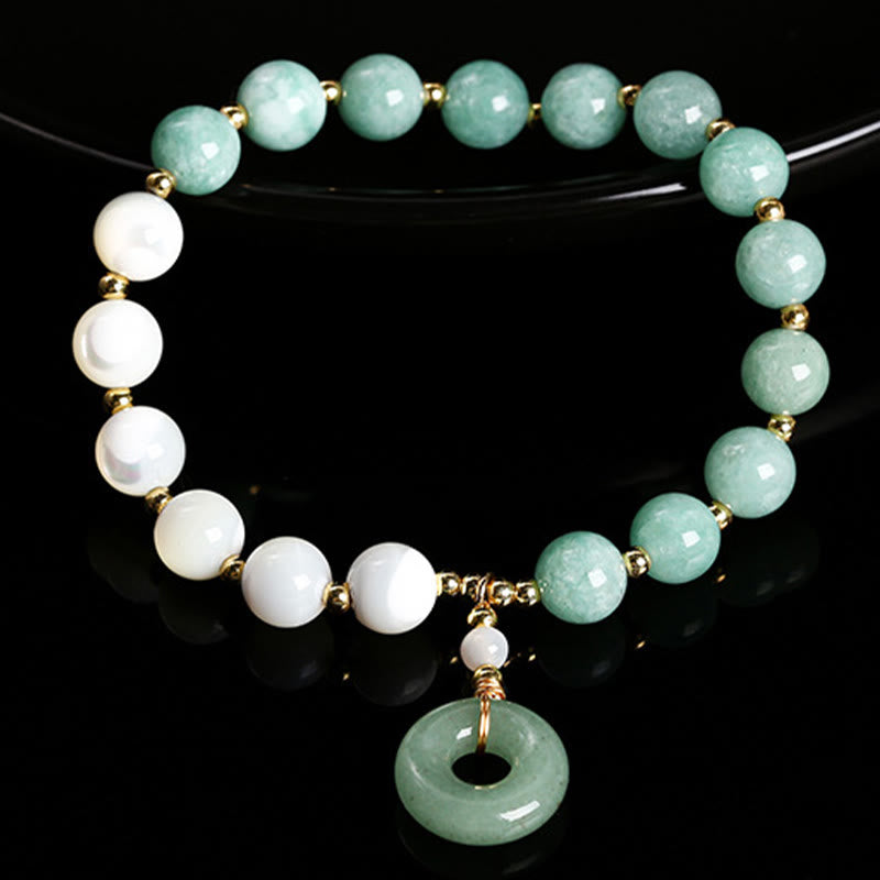 Pulsera con dije de paz y hebilla de caracol, herradura, trochus y Buddha Stones