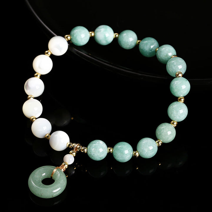 Pulsera con dije de paz y hebilla de caracol, herradura, trochus y Buddha Stones